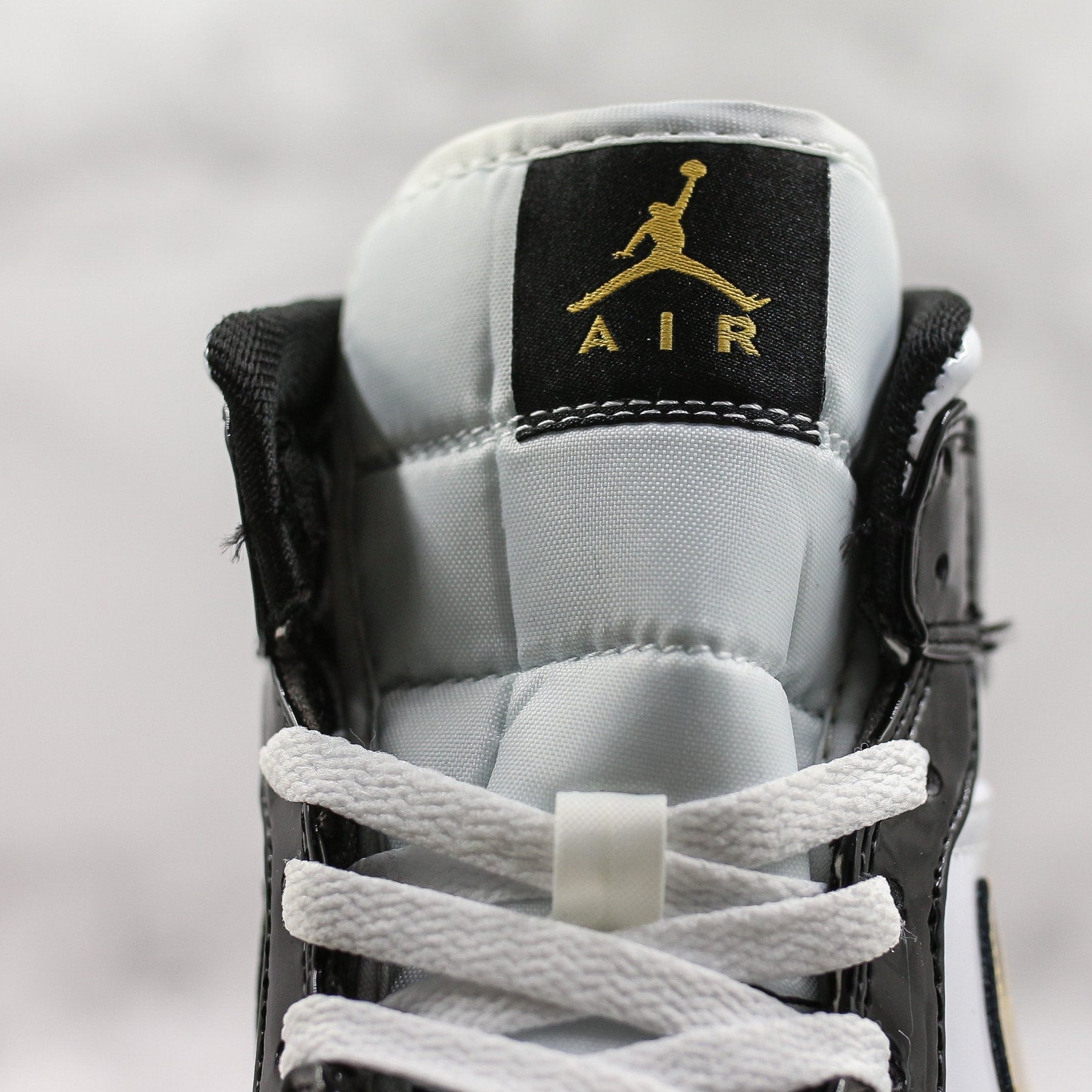 Air Jordan 1 Mid Patent Black White Gold
